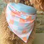 Reversible dog bandana with colorful pink, blue, cream, and orange checkered print lightweight, breathable, and handmade in Puerto Rico.