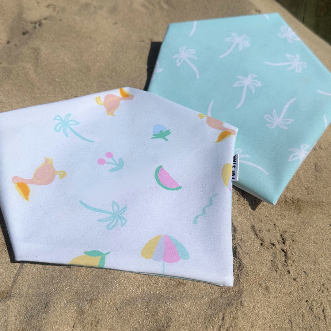 Reversible summer dog bandana with playful beach-themed prints — waterproof, lightweight, and perfect for sunny adventures.