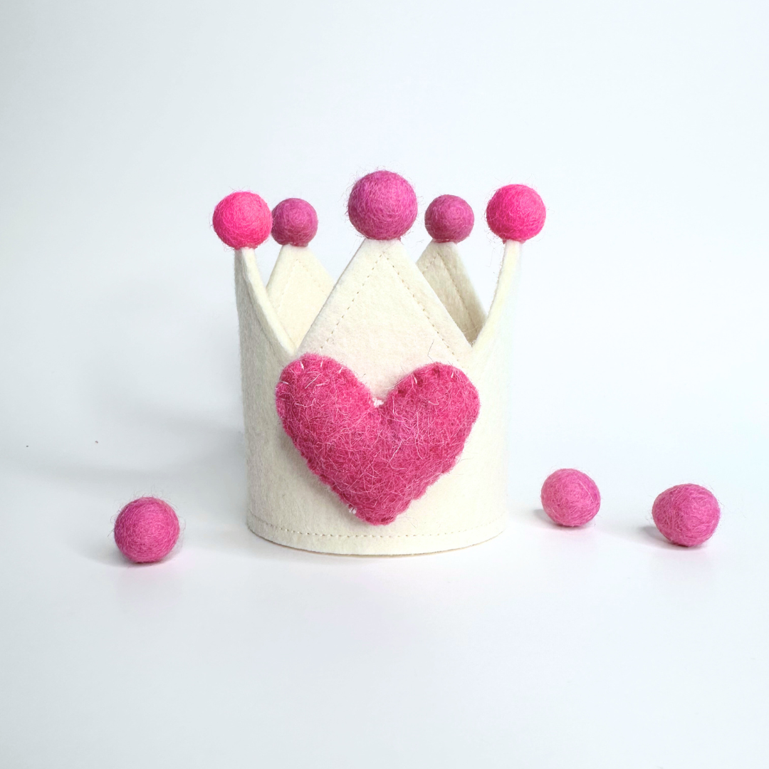 Mini celebration crown for dogs, cats, or kids made of high-quality felt with adjustable elastic for a comfy fit.