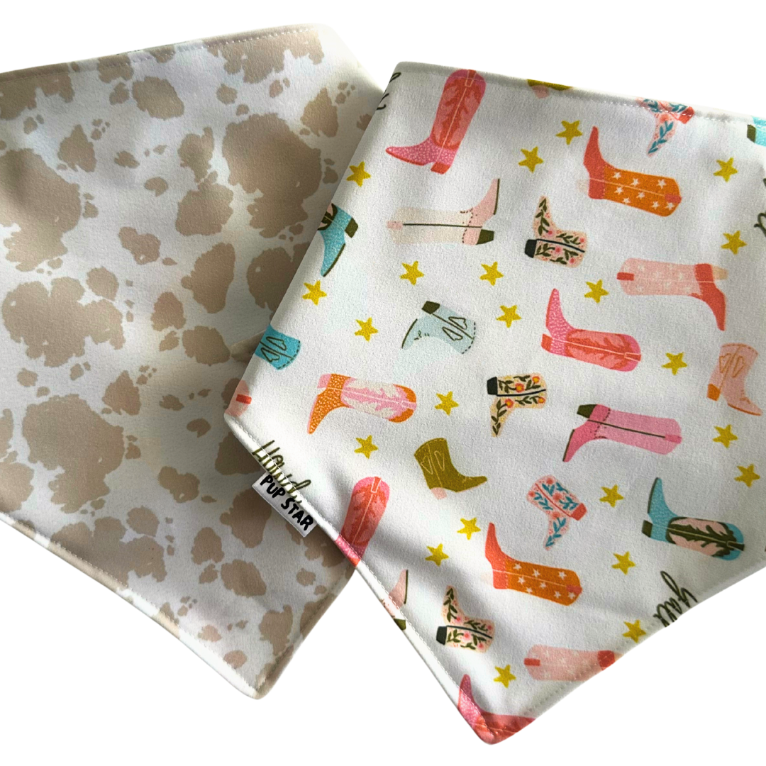 Reversible dog bandana with cowboy boots and cream cow print — waterproof, lightweight, and full of western charm.