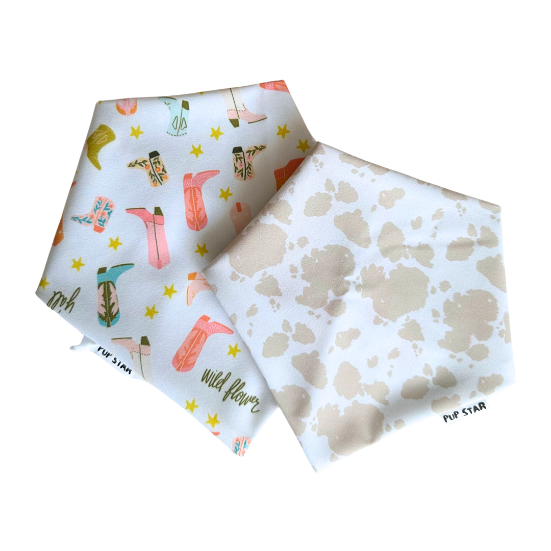 Reversible dog bandana with cowboy boots and cream cow print — waterproof, lightweight, and full of western charm.