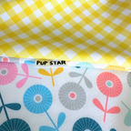 Reversible spring dog bandana with floral and yellow picnic prints – waterproof, lightweight, and perfect for sunny adventures.