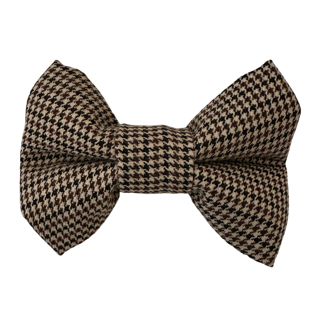 Brown and cream houndstooth dog bow tie crafted from soft cotton for a classic, elegant, and comfortable look. Easily attaches to any collar.

