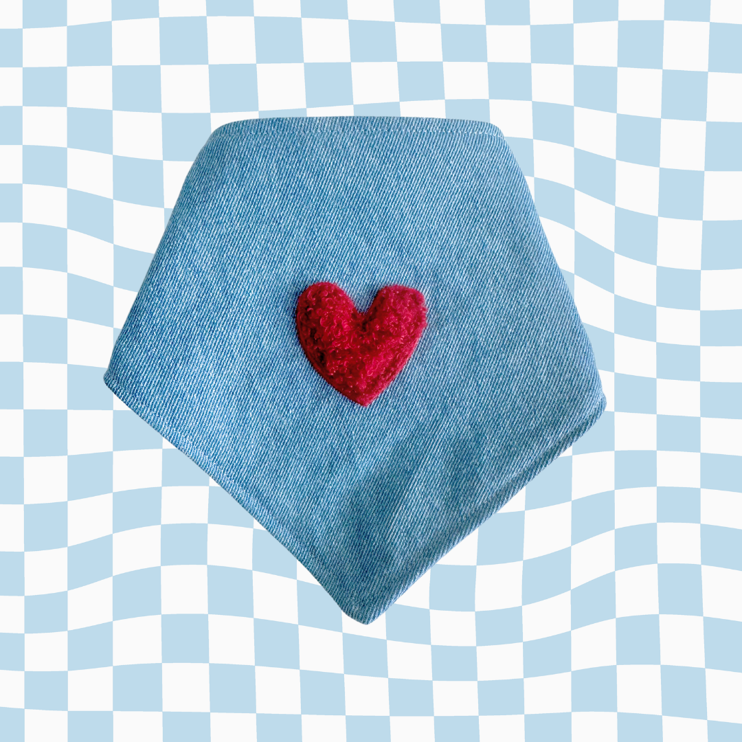 Dog bandana, denim fabric and features a plush red heart at the center a bold and adorable detail that stands out in any setting.