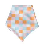 Reversible dog bandana with colorful pink, blue, cream, and orange checkered print lightweight, breathable, and handmade in Puerto Rico.